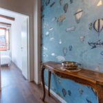 Ca Zulian Venice Apartment with canal view fornasetti wallpaper macchine volanti