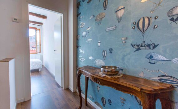 Ca Zulian Venice Apartment with canal view fornasetti wallpaper macchine volanti