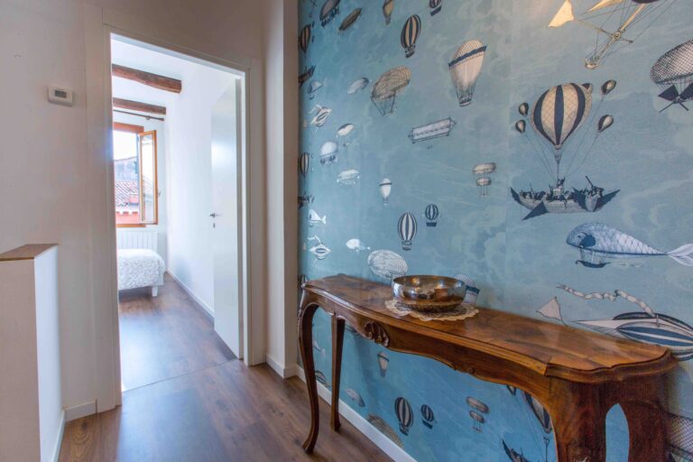 Ca Zulian Venice Apartment with canal view fornasetti wallpaper macchine volanti